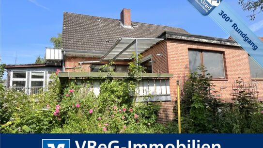 Vollunterkellertes Einfamilienhaus mit Einliegerwohnung und zwei Garagen